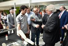 Dr. Gaétan Barrette, Québec's Minister of Health and Social Services, visiting a kiosk at the inauguration of the TransMedTech Institute on April 24th, 2017.